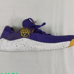 Nike Purple Athletic Running Shoe with White Speckled Sole and Yellow Accent